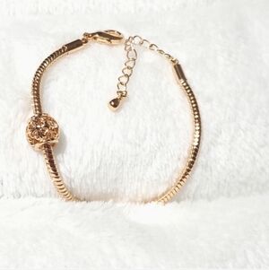 Generic Rose gold pandora style charmed bracelet